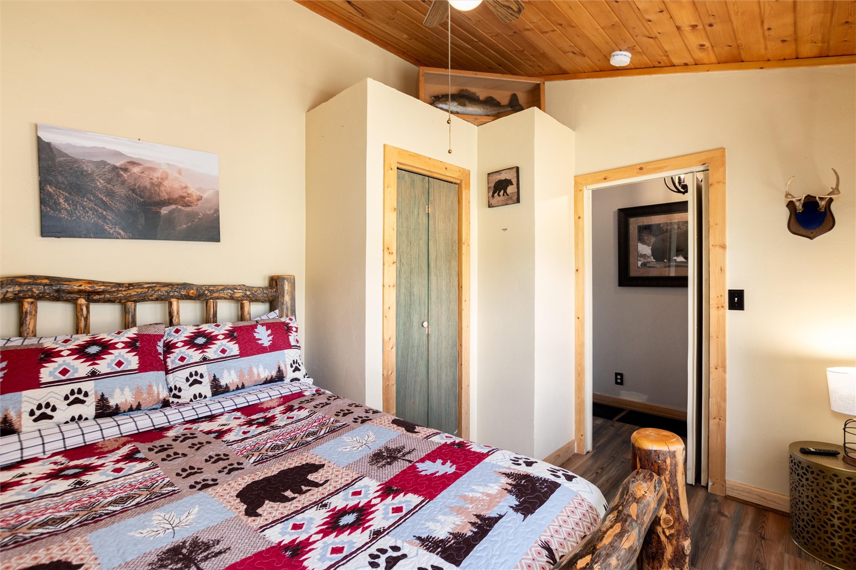 1301 Sheep Ridge Road Fairplay, CO 80440 - Photo 26 of 49 Bedroom featuring a natural wood plank ceiling, light-toned walls, and wood-finish flooring