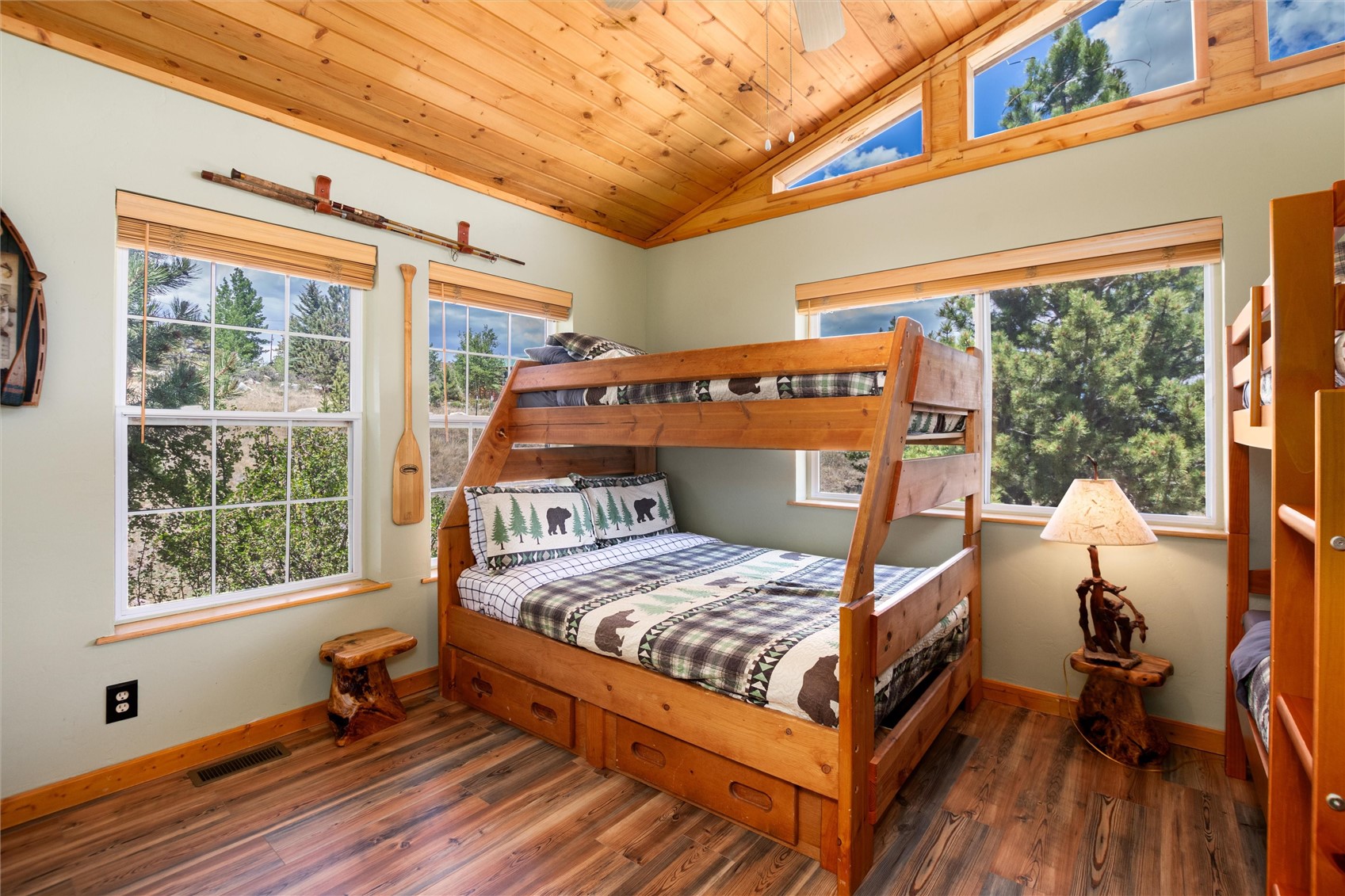 1301 Sheep Ridge Road Fairplay, CO 80440 - Photo 30 of 49 a bedroom with a bed and wooden floor
