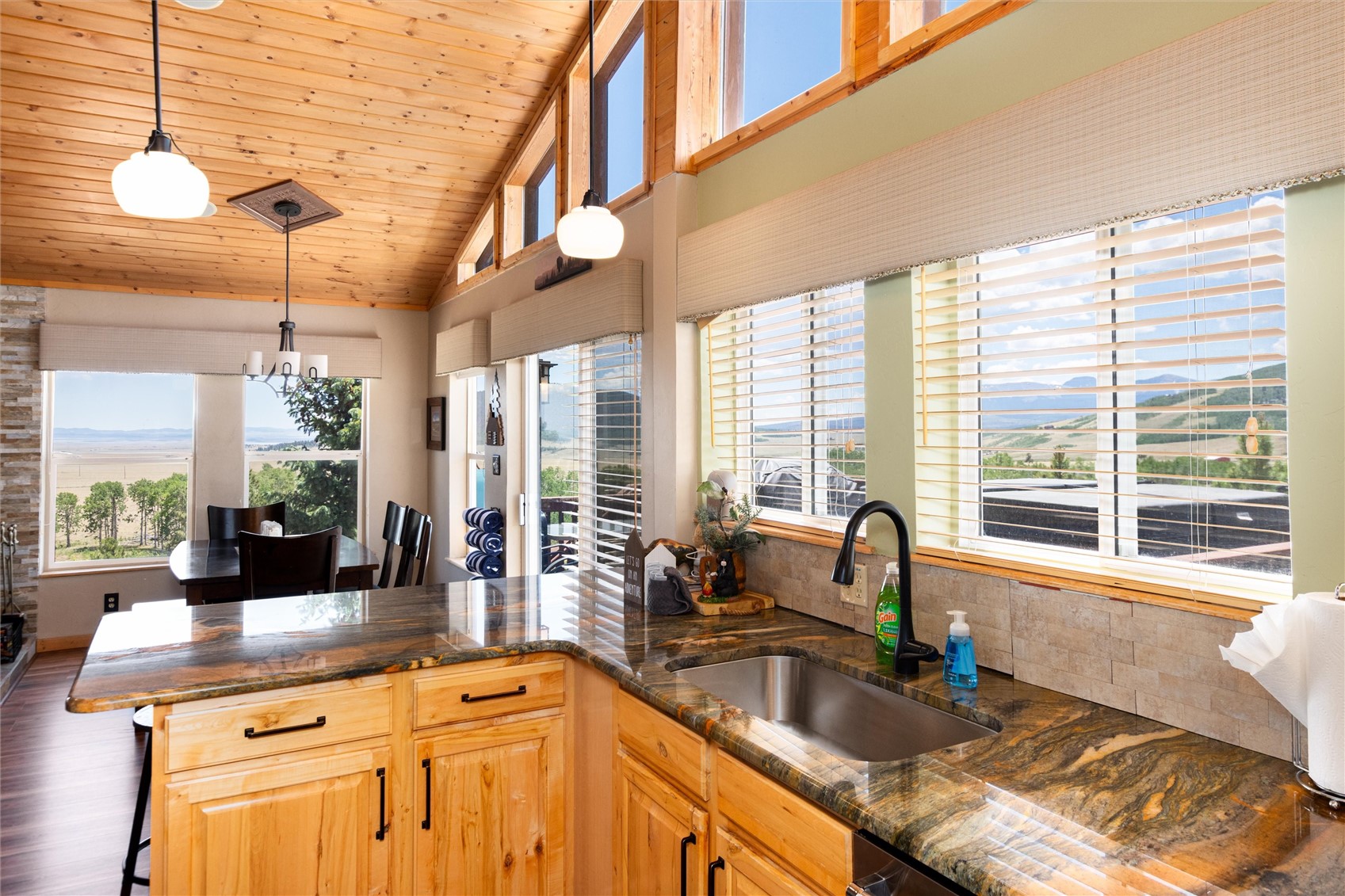 1301 Sheep Ridge Road Fairplay, CO 80440 - Photo 3 of 49 Kitchen featuring wood-finish cabinetry, stone countertops, and a stainless steel sink
