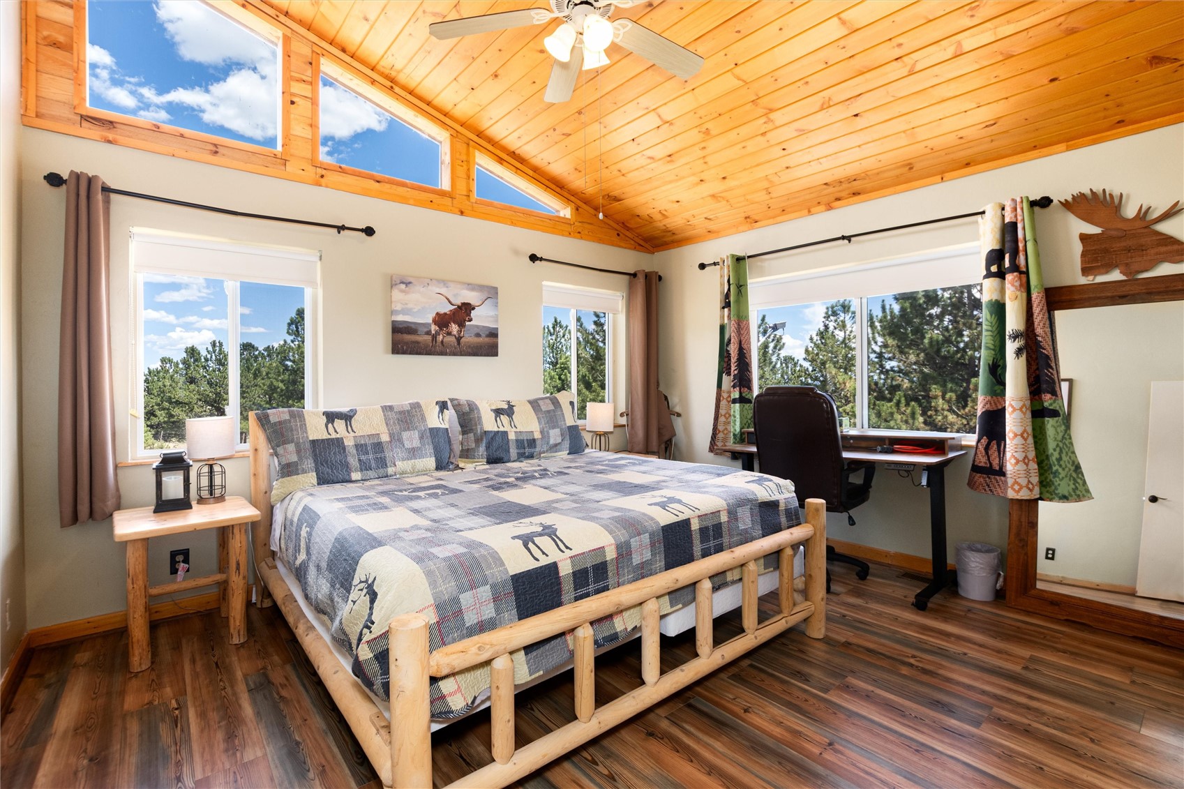 1301 Sheep Ridge Road Fairplay, CO 80440 - Photo 35 of 49 a large bedroom with a bed and wooden floor