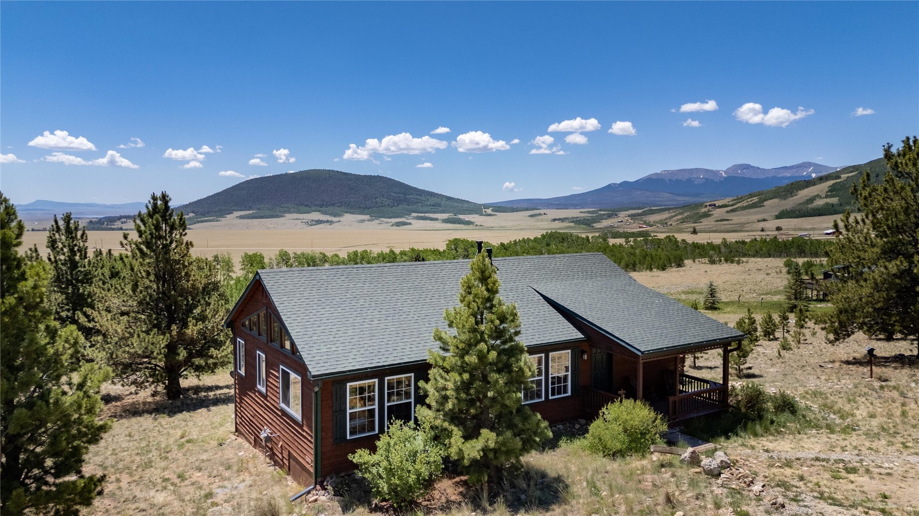 1301 Sheep Ridge Road Fairplay, CO 80440 - Photo 4 of 49 a view of a house with a yard and balcony