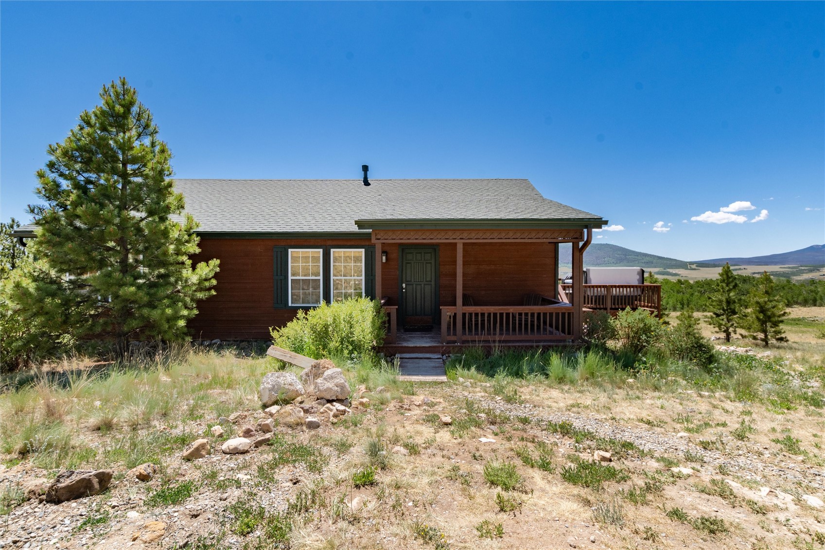 1301 Sheep Ridge Road Fairplay, CO 80440 - Photo 44 of 49 Wood-sided exterior featuring a covered front porch and an expansive side deck