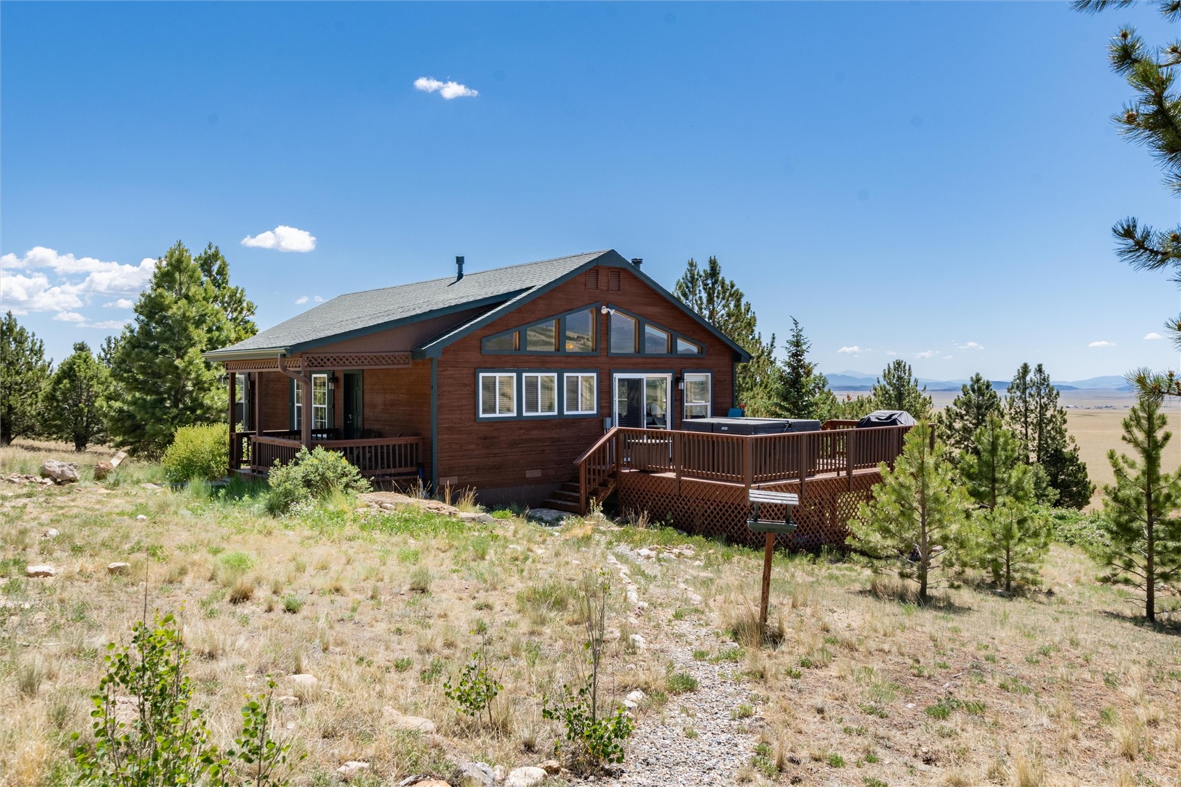 1301 Sheep Ridge Road Fairplay, CO 80440 - Photo 49 of 49 Wood-sided cabin-style residence featuring a large wood deck with a built-in hot tub