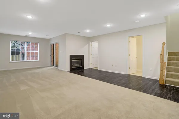 a view of an empty room with stairs