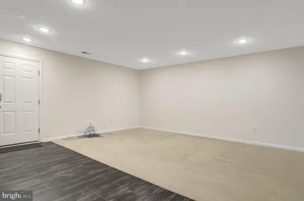 a bathroom with a sink a mirror and a shower