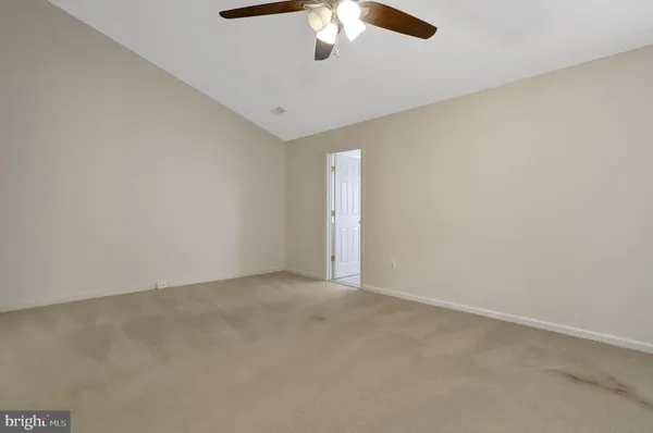 a white bath tub sitting in a bathroom next to a window