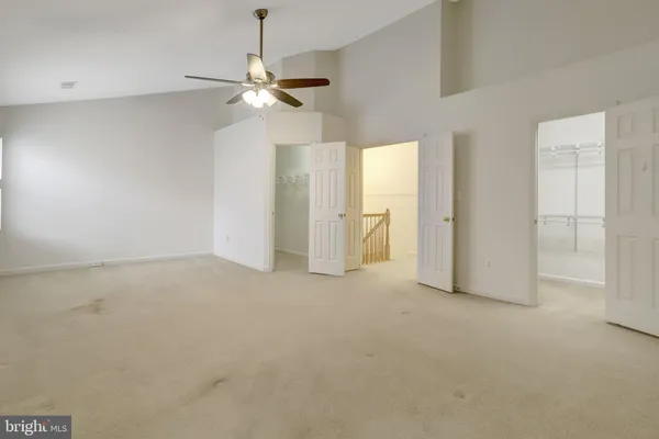 a bathroom with a granite countertop sink mirror and cabinets