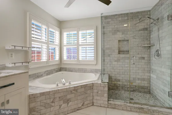 a view of a balcony with wooden floor and fence