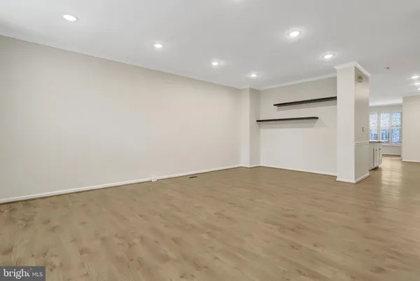 a kitchen with granite countertop a stove a sink and a refrigerator