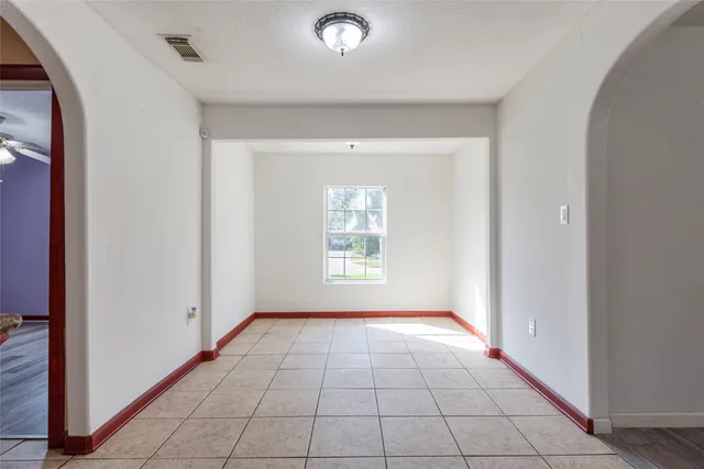 a view of an empty room and window