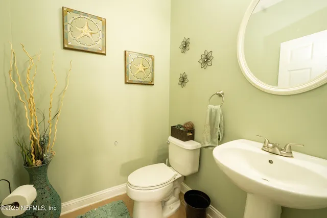a bathroom with a toilet and a sink