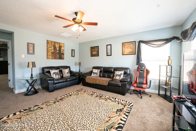 a living room with furniture and a window