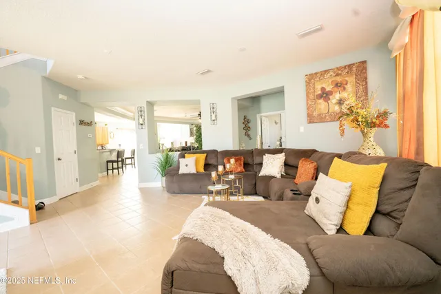 a living room with furniture and a table