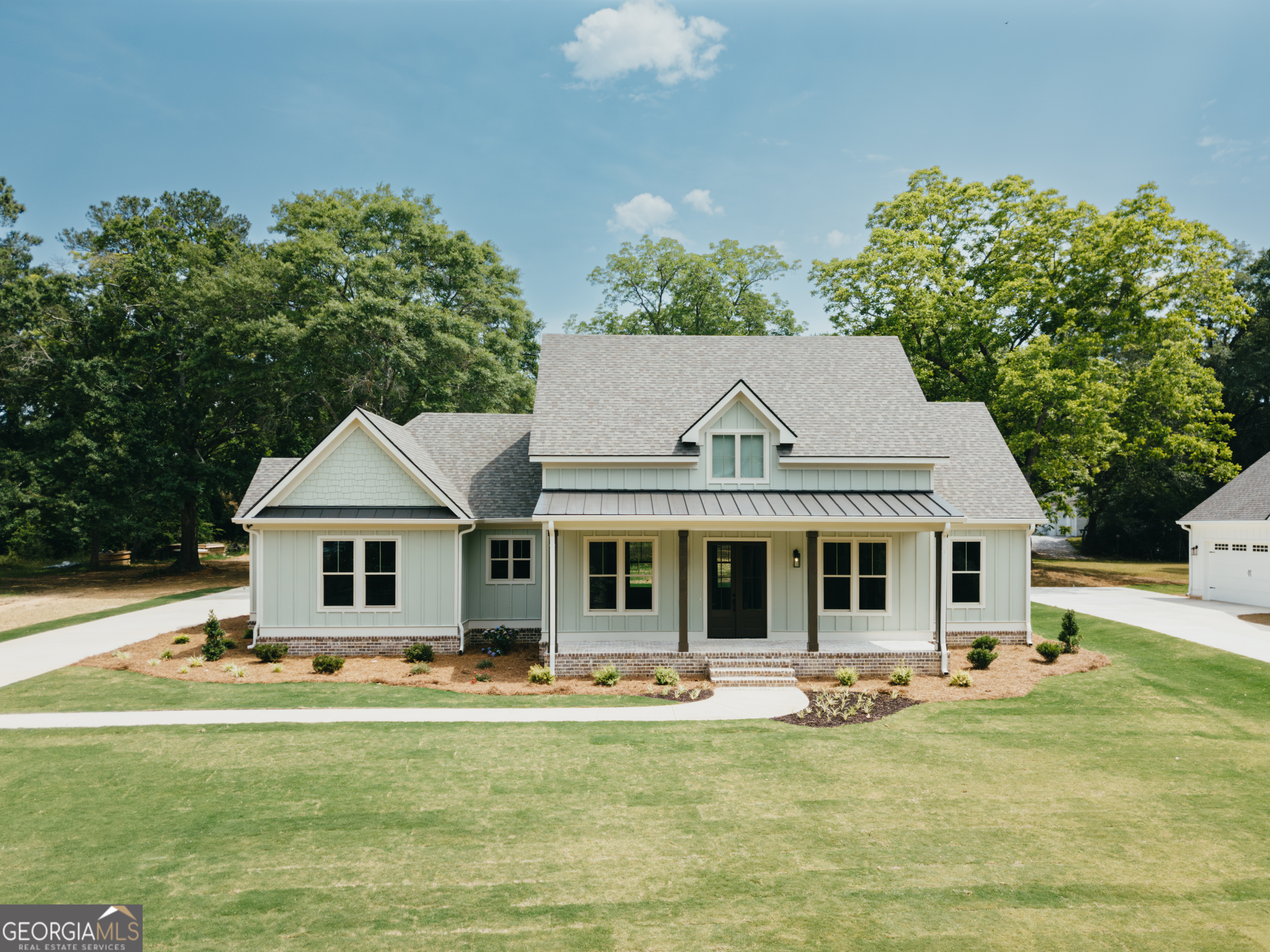 170 West Main Street Rutledge, GA 30663 - Photo 1 of 1 a front view of a house with swimming pool having outdoor seating