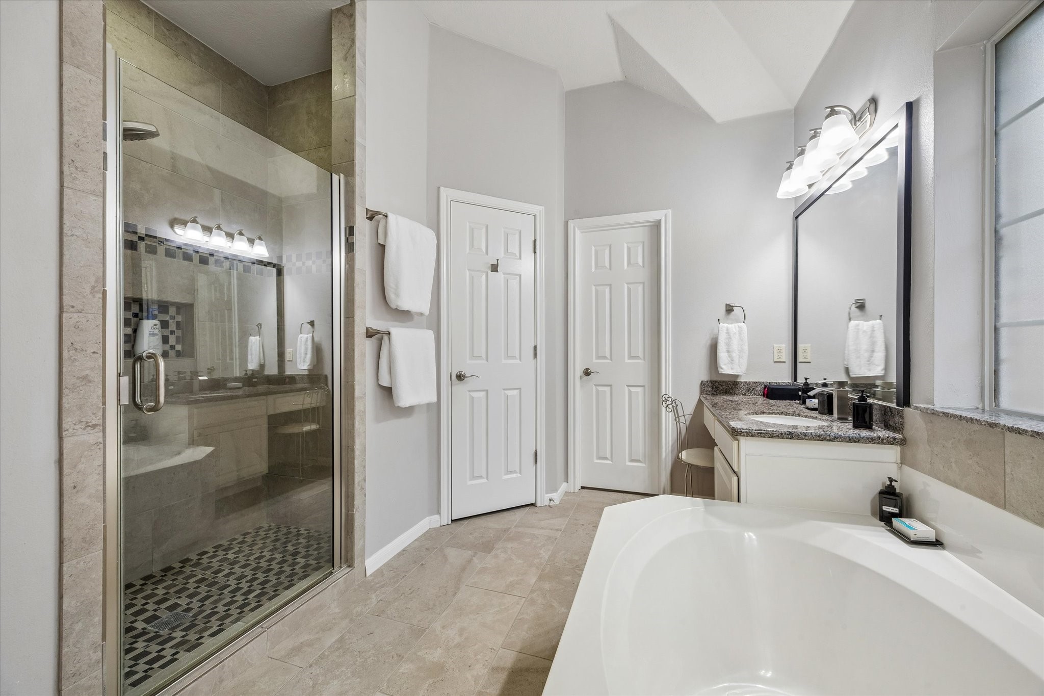 12423 Rutgers Park Court Houston, TX 77058 - Photo 21 of 29 a bathroom with a double vanity sink shower and a mirror