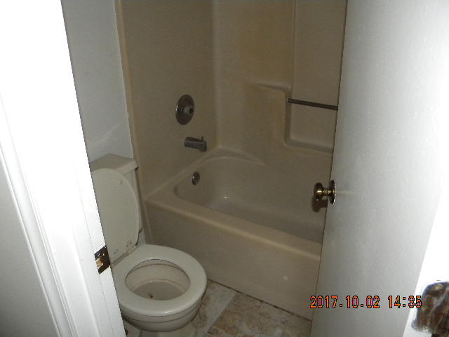 3341 Forest Ridge Road Roanoke, VA 24018 - Photo 7 of 18 a white bath tub sitting next to a toilet