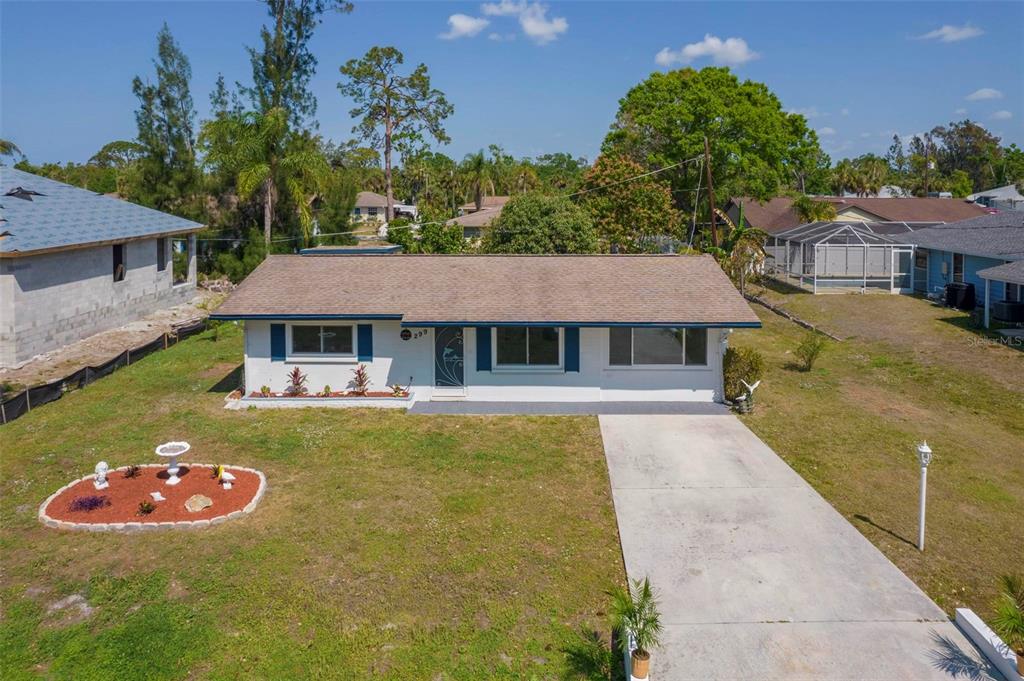 299 Nightingale Road Venice, FL 34293 - Photo 1 of 1 an aerial view of a house with swimming pool and big yard