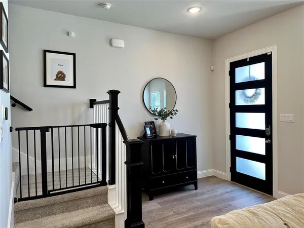 a view of a livingroom with furniture and entryway