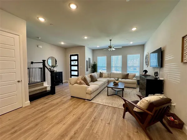 a living room with furniture or couch and a wooden floor