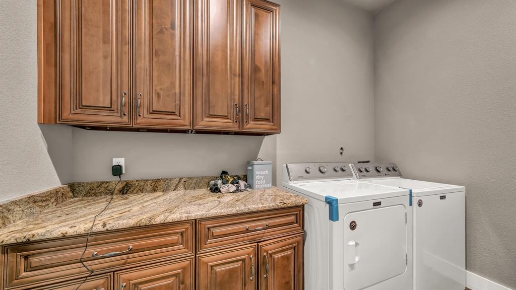 143 Oak Tree Drive Poolville, TX 76487 - Photo 17 of 40 a utility room with granite countertop a sink and dishwasher