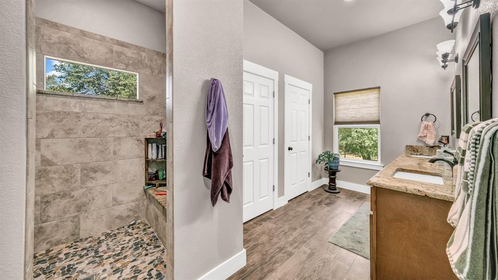 143 Oak Tree Drive Poolville, TX 76487 - Photo 19 of 40 a living room with furniture and a gate