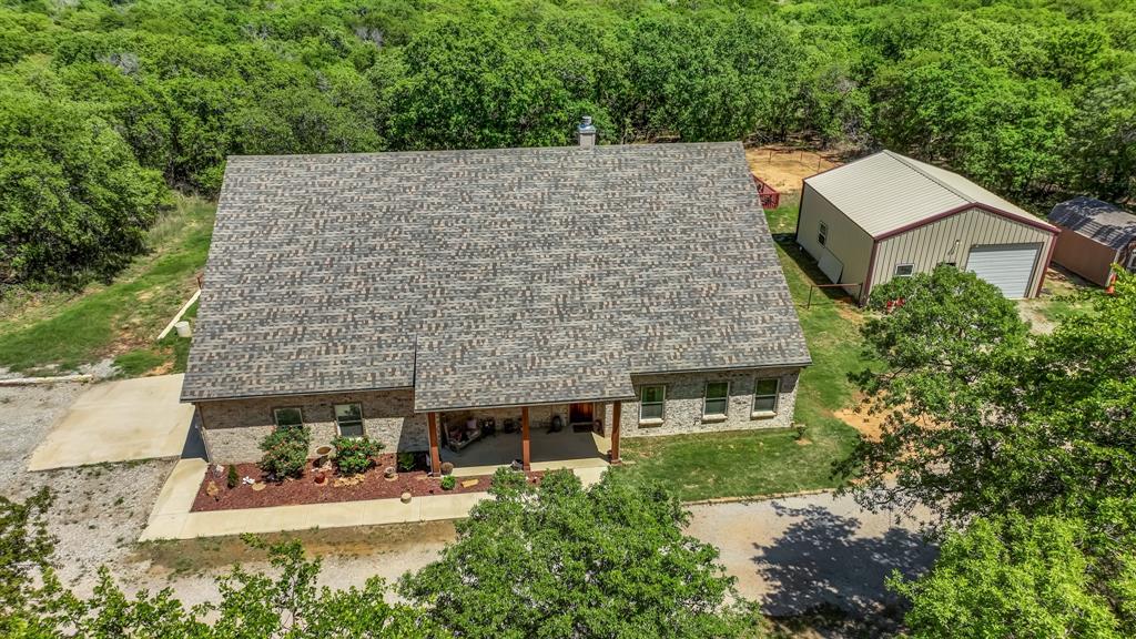143 Oak Tree Drive Poolville, TX 76487 - Photo 3 of 40 aerial view of a house with a yard