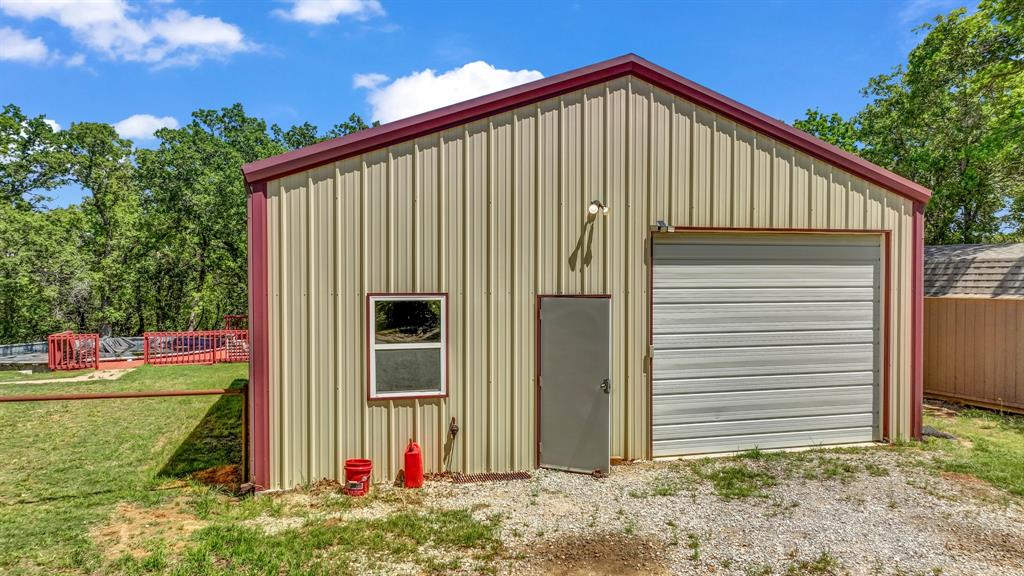 143 Oak Tree Drive Poolville, TX 76487 - Photo 32 of 40 a view of a house with backyard