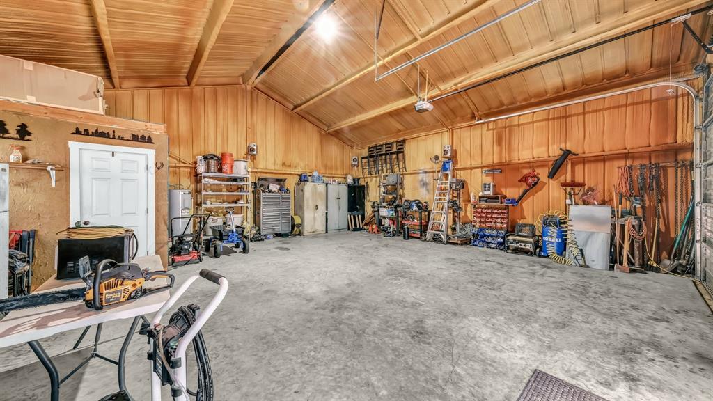 143 Oak Tree Drive Poolville, TX 76487 - Photo 33 of 40 a view of a room with gym equipment