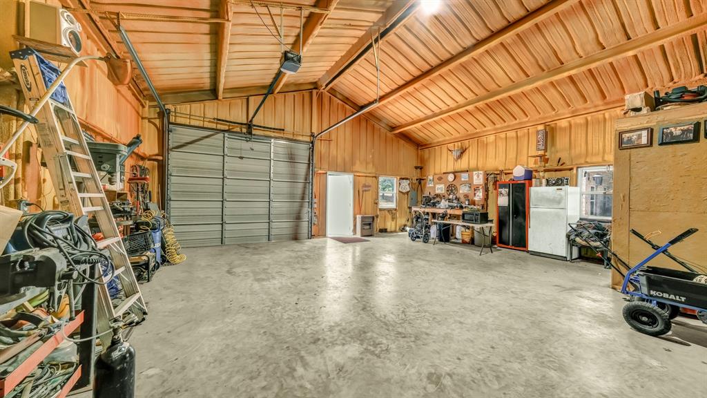 143 Oak Tree Drive Poolville, TX 76487 - Photo 34 of 40 a view of a garage with storage