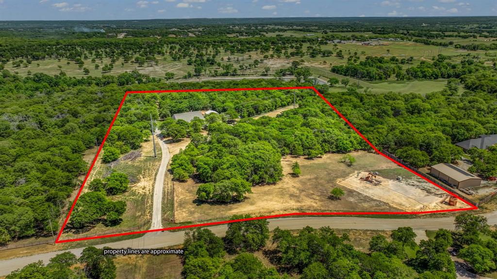 143 Oak Tree Drive Poolville, TX 76487 - Photo 40 of 40 a view of a yard with an outdoor space