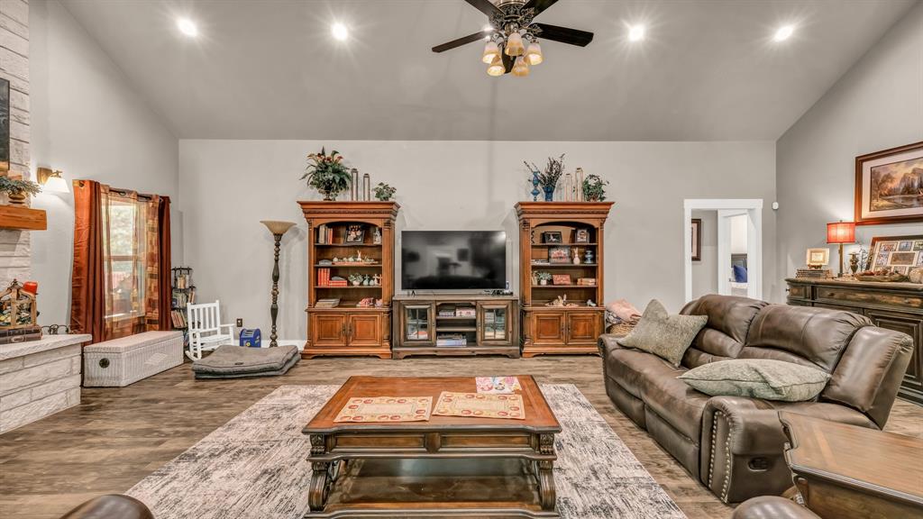 143 Oak Tree Drive Poolville, TX 76487 - Photo 8 of 40 a living room with furniture and flat screen tv