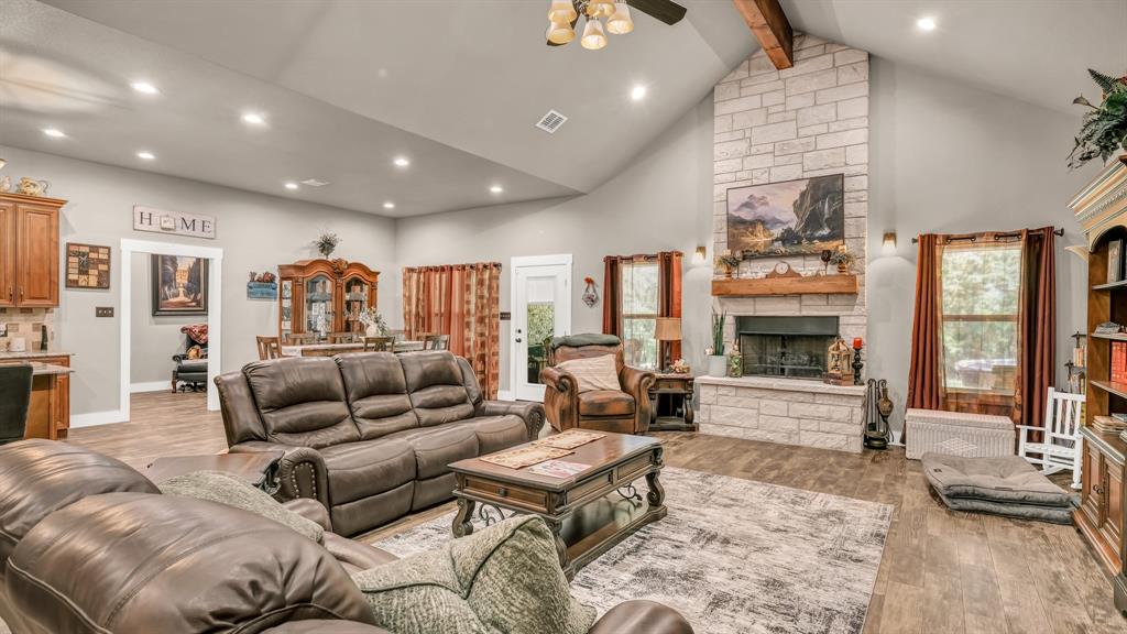 143 Oak Tree Drive Poolville, TX 76487 - Photo 9 of 40 a living room with furniture and a fireplace