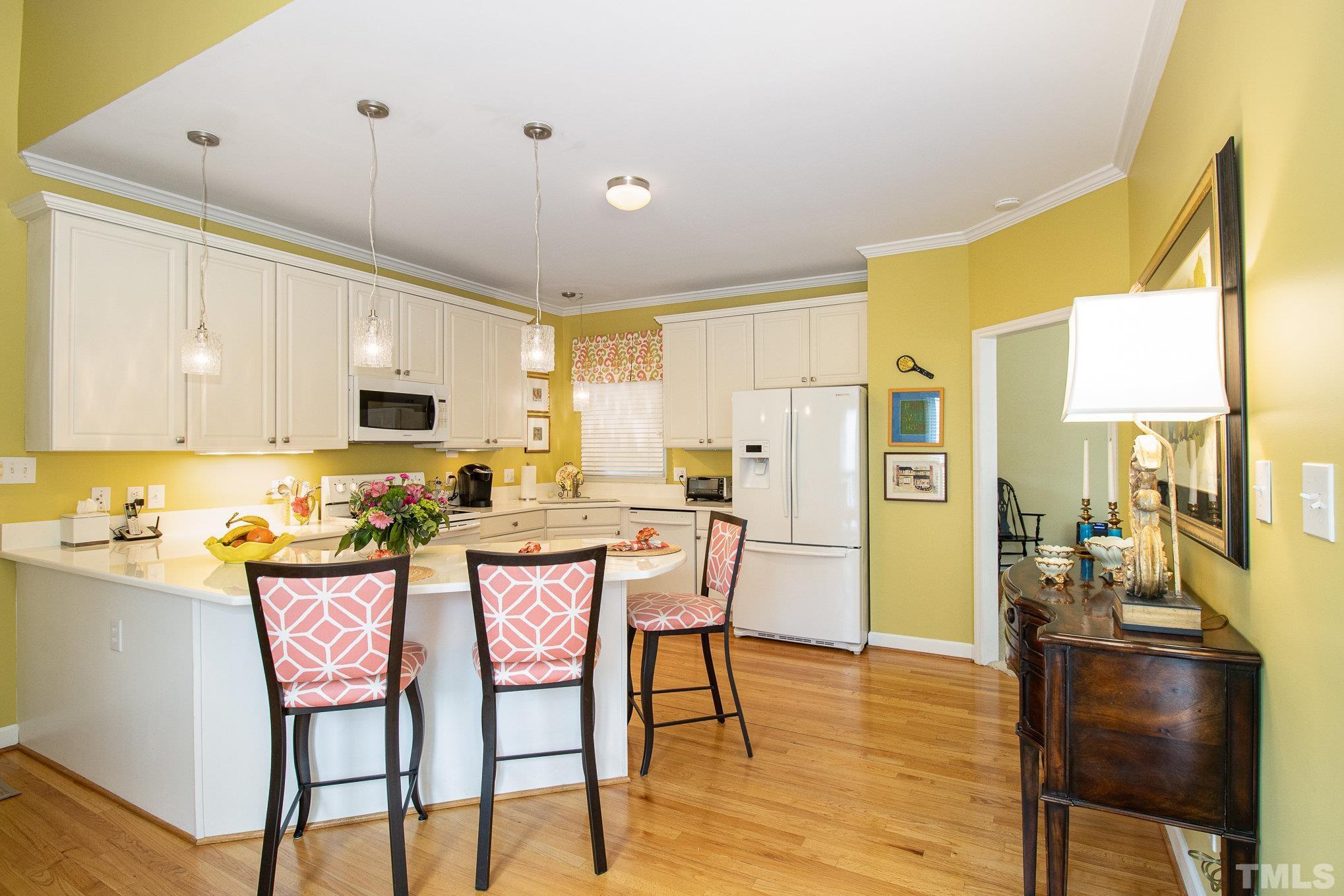 313 Boltstone Court Cary, NC 27513 - Photo 11 of 28 a view of a dining room with furniture and wooden floor