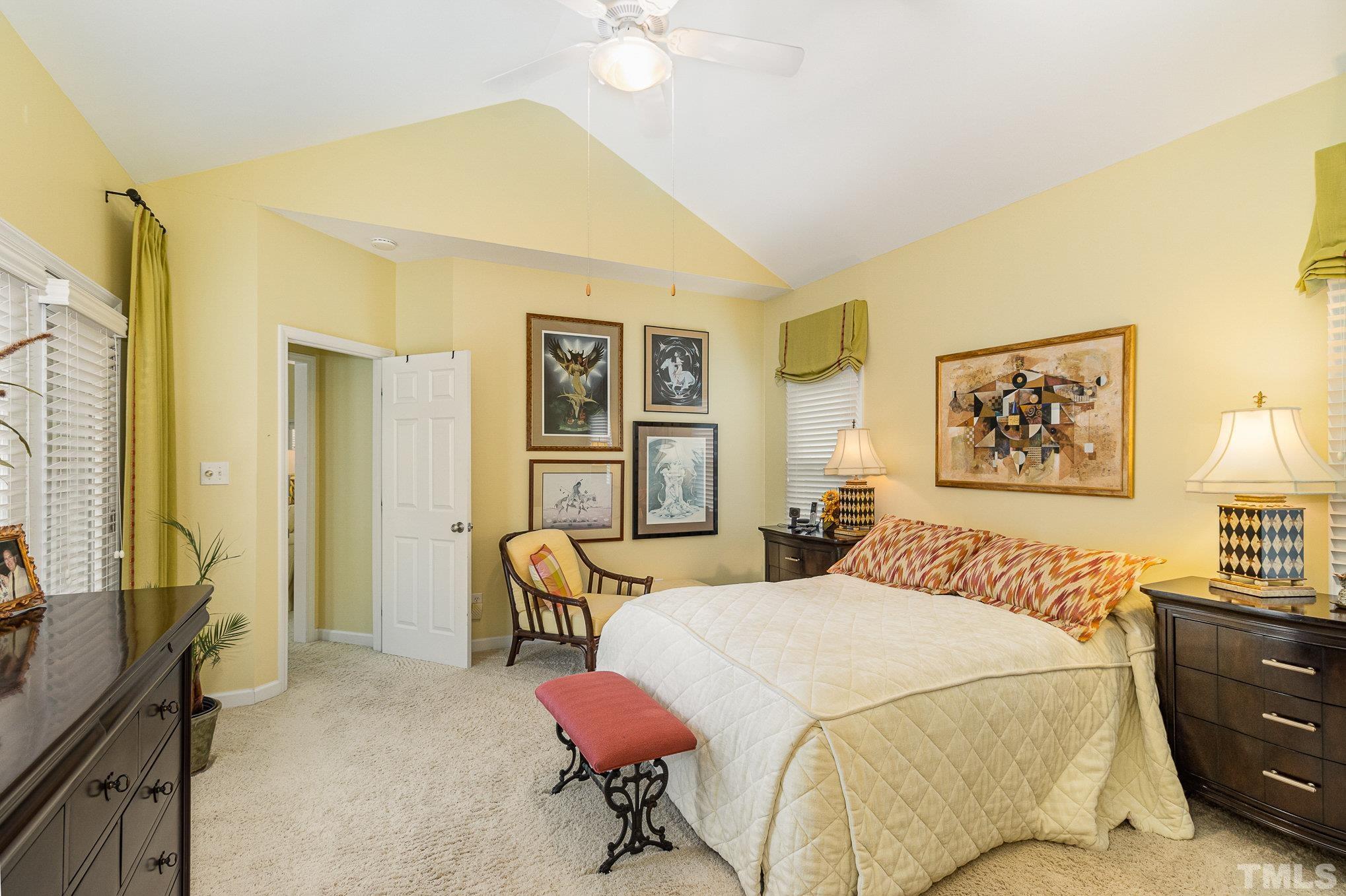 313 Boltstone Court Cary, NC 27513 - Photo 14 of 28 a bedroom with a bed and wooden floor