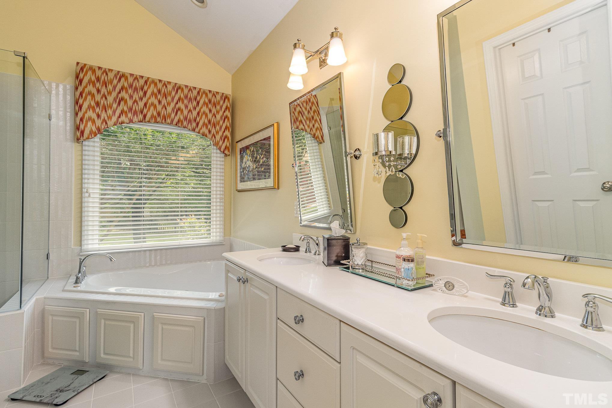 313 Boltstone Court Cary, NC 27513 - Photo 15 of 28 a bathroom with a double vanity sink mirror and bathtub