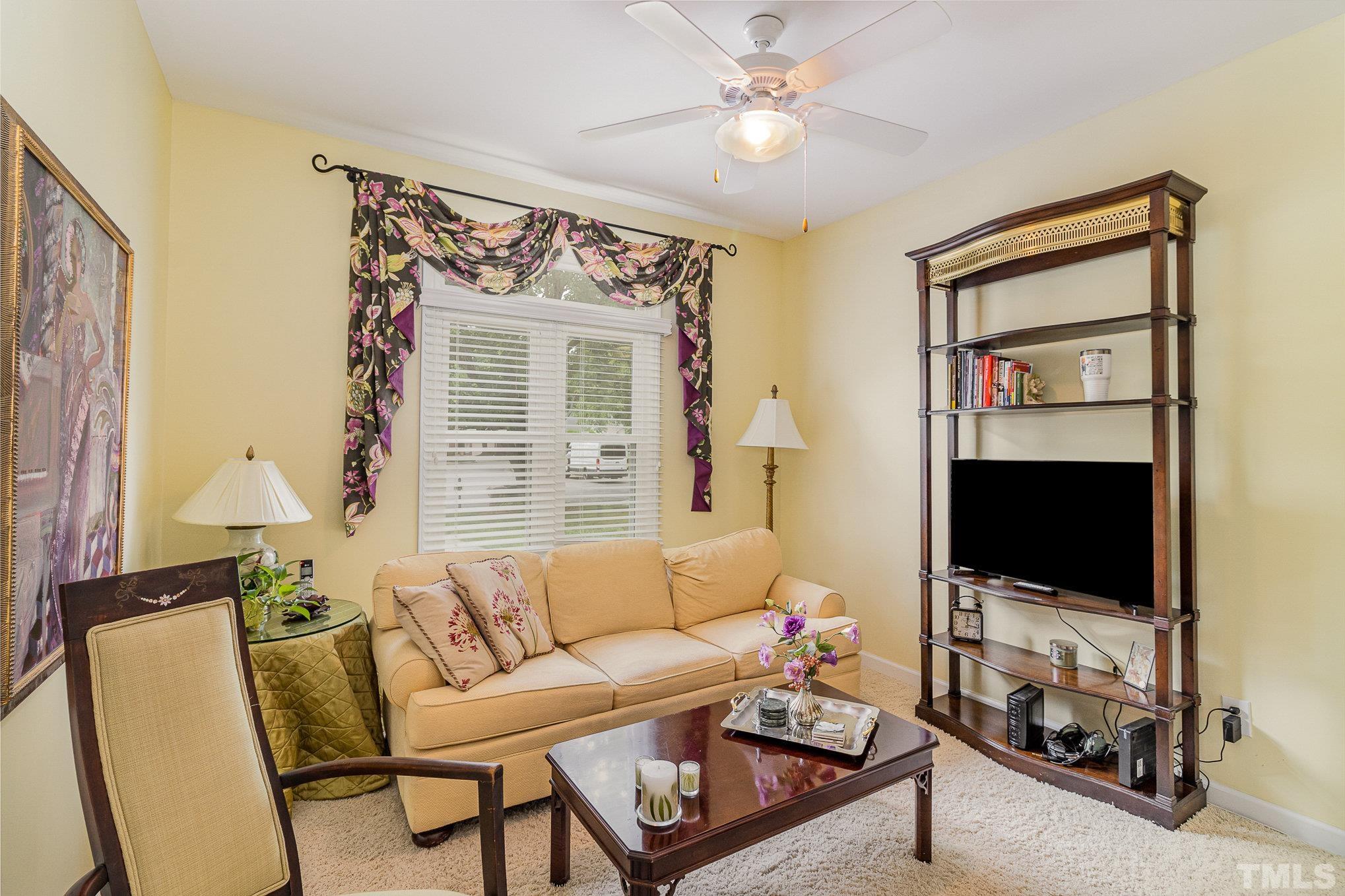 313 Boltstone Court Cary, NC 27513 - Photo 18 of 28 a living room with furniture and a flat screen tv