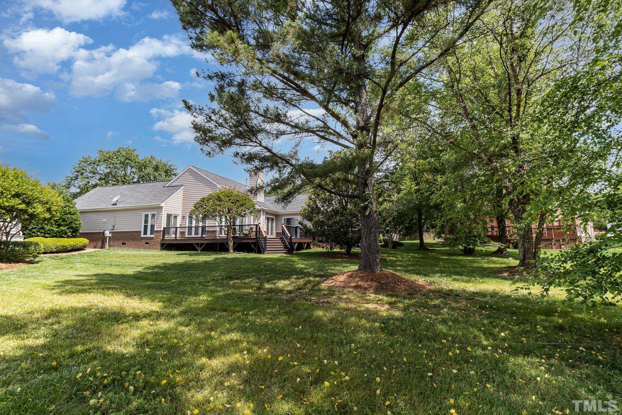 313 Boltstone Court Cary, NC 27513 - Photo 26 of 28 a view of a big yard next to a house