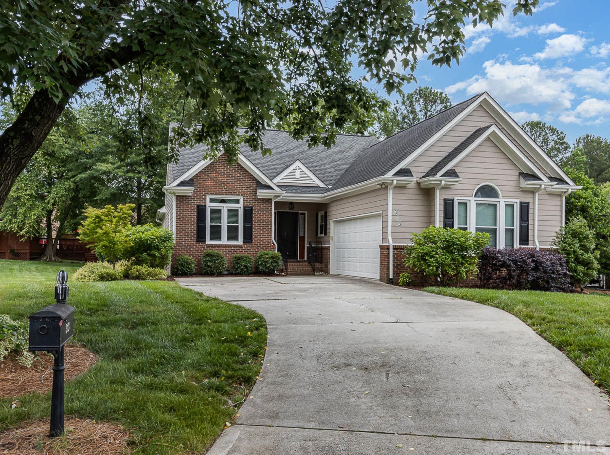 313 Boltstone Court Cary, NC 27513 - Photo 28 of 28 a front view of a house with a yard and trees