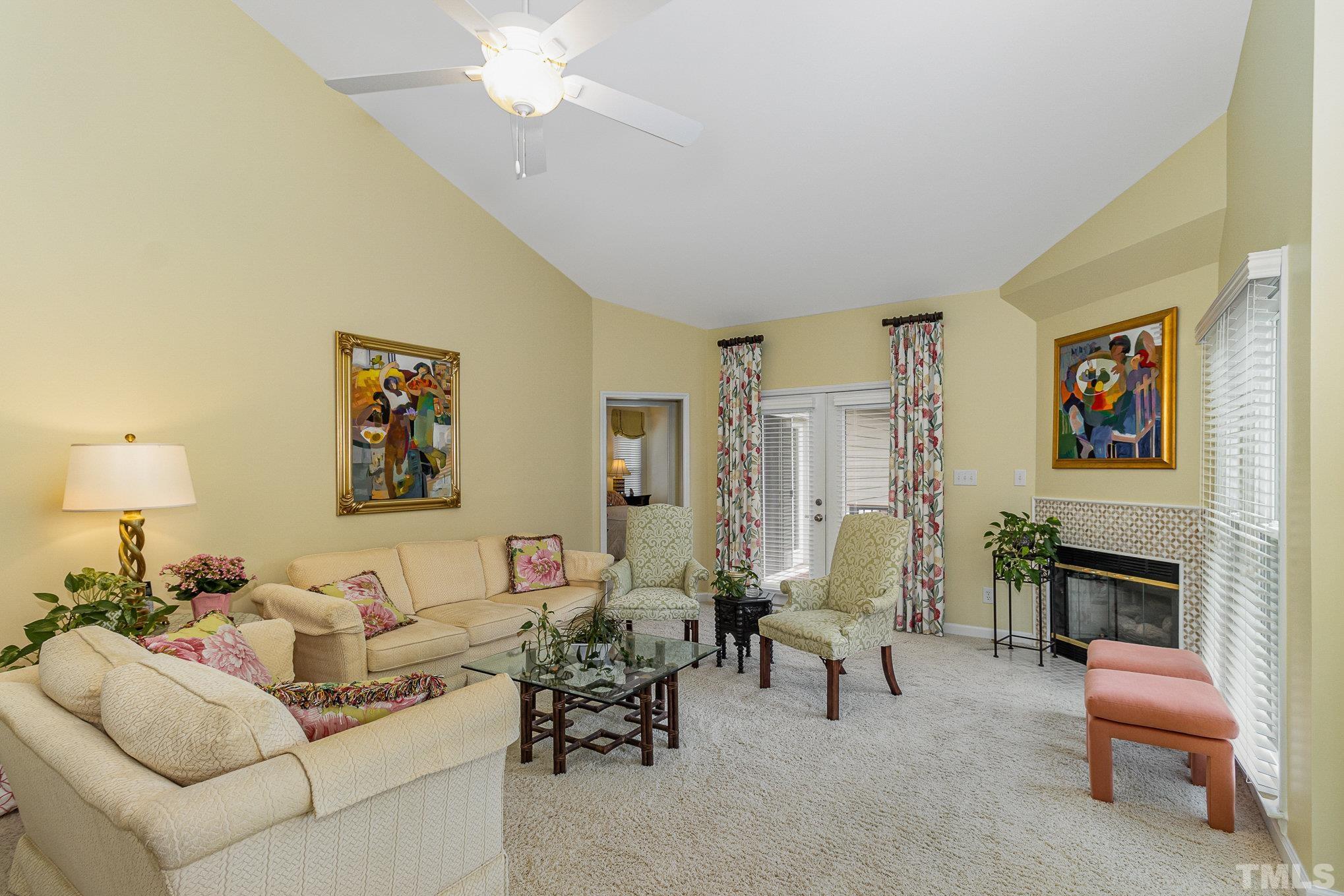 313 Boltstone Court Cary, NC 27513 - Photo 4 of 28 a living room with furniture and a fireplace