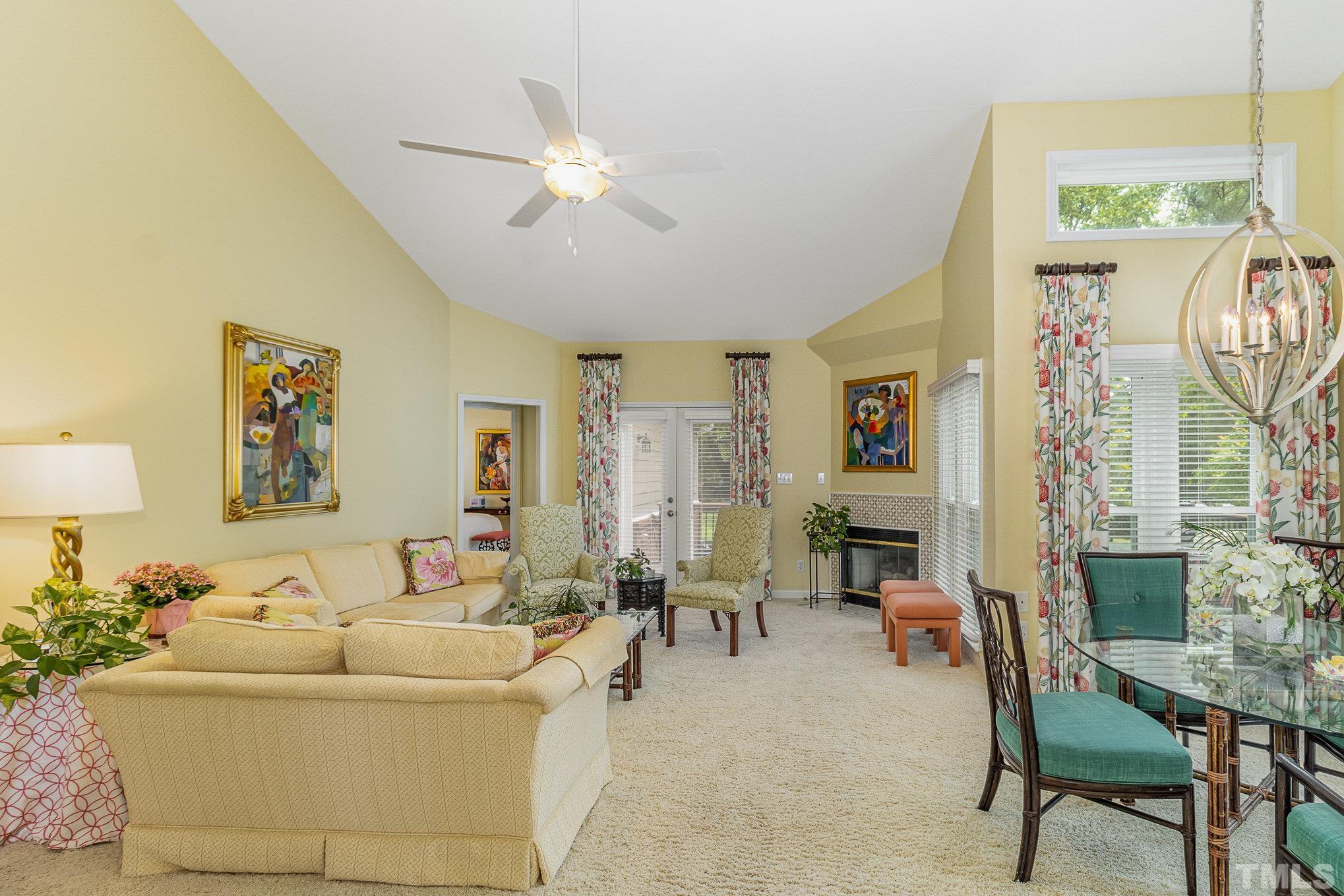 313 Boltstone Court Cary, NC 27513 - Photo 7 of 28 a living room with furniture and a chandelier