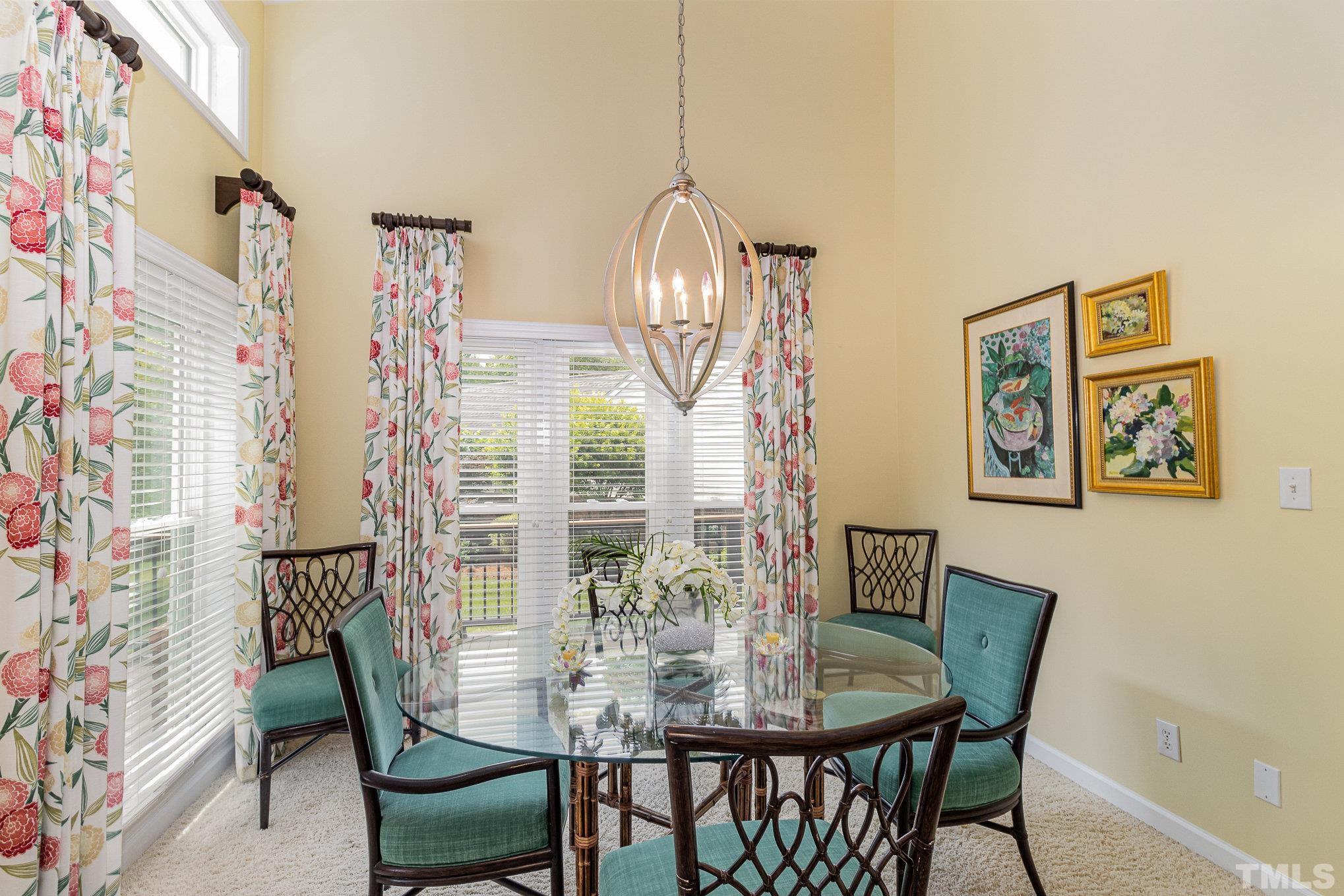 313 Boltstone Court Cary, NC 27513 - Photo 8 of 28 a view of a dining room with furniture and chandelier
