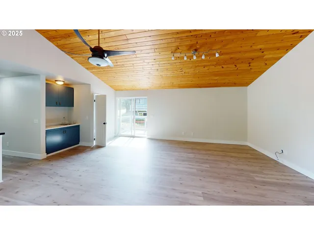 a open hall with a wooden floor