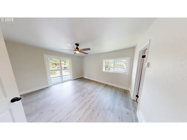 a upper view of a room with wooden floor and window