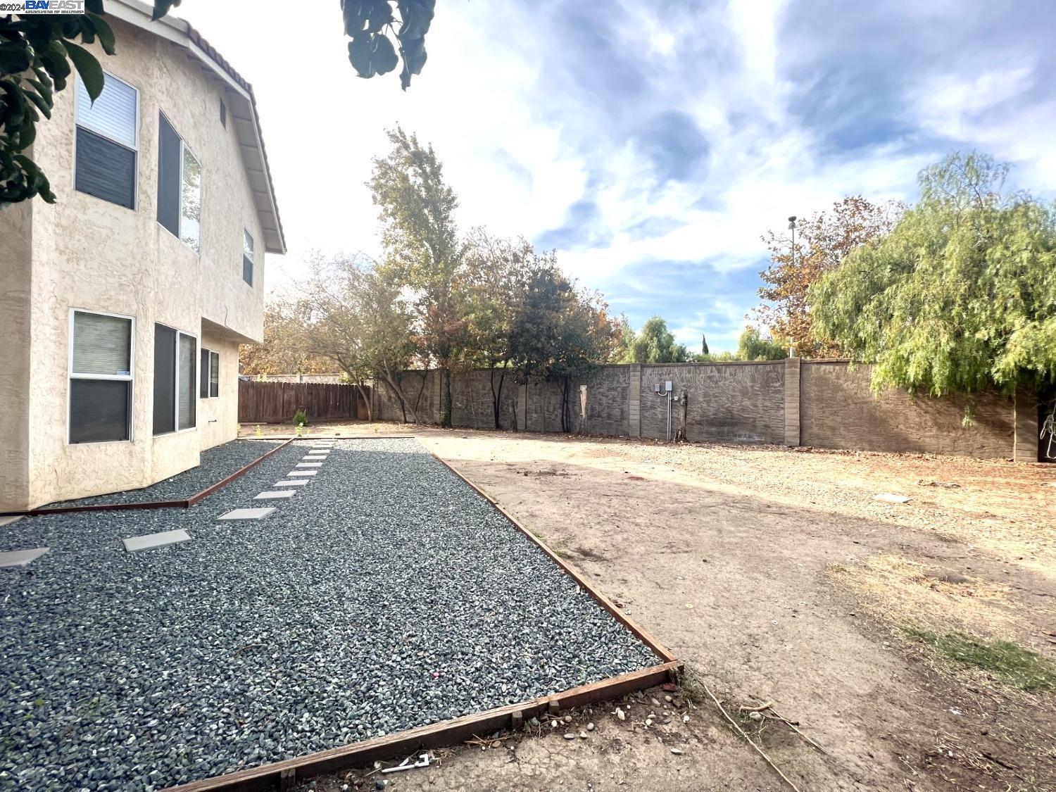95377 Scott Tracy, CA 93577 - Photo 16 of 46 a view of a backyard with large trees