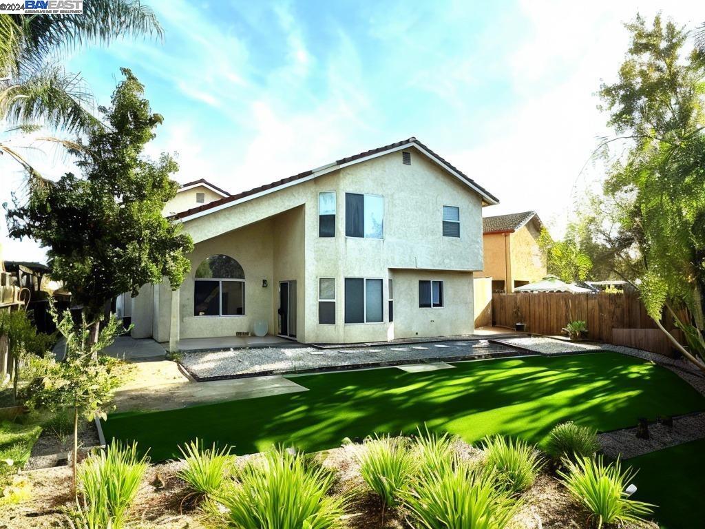 95377 Scott Tracy, CA 93577 - Photo 22 of 46 a front view of house with yard and green space