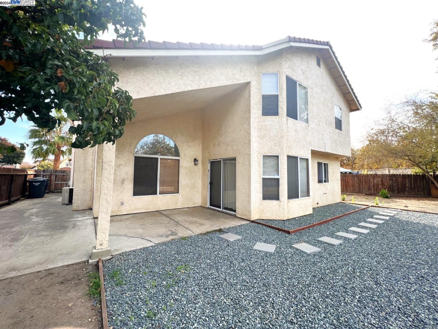 95377 Scott Tracy, CA 93577 - Photo 23 of 46 a front view of a house with a yard