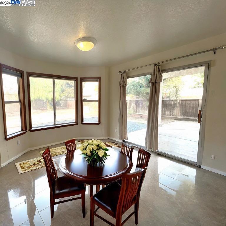95377 Scott Tracy, CA 93577 - Photo 31 of 46 a view of a dining room with furniture and window
