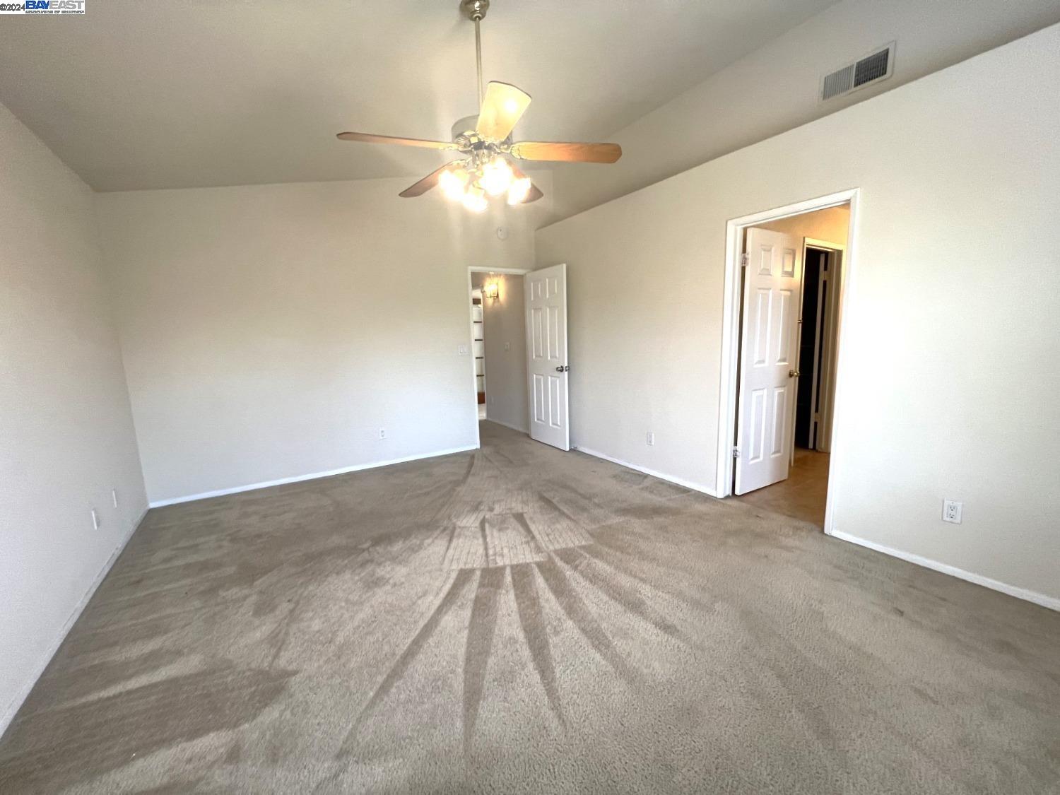 95377 Scott Tracy, CA 93577 - Photo 4 of 46 a view of an empty room with a chandelier fan
