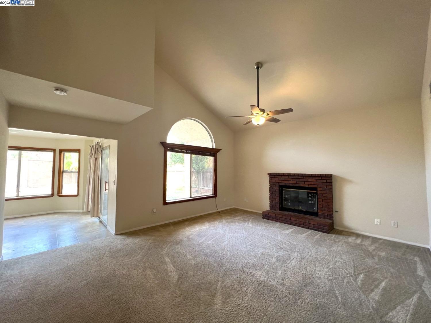 95377 Scott Tracy, CA 93577 - Photo 5 of 46 an empty room with windows and fireplace