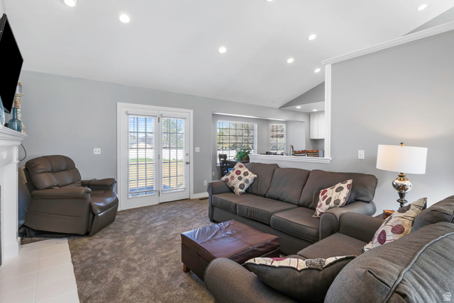 13176 Day Court Draper, UT 84020 - Photo 5 of 45 Living room with vaulted ceiling, recessed lighting, carpet floors, and a fireplace